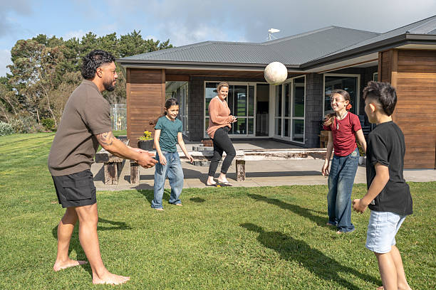istock Family Playing Soccer Together in Backyard 2237490033