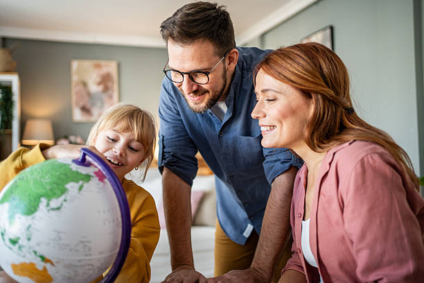 istock Family learning geography together while planning a trip 2237498139