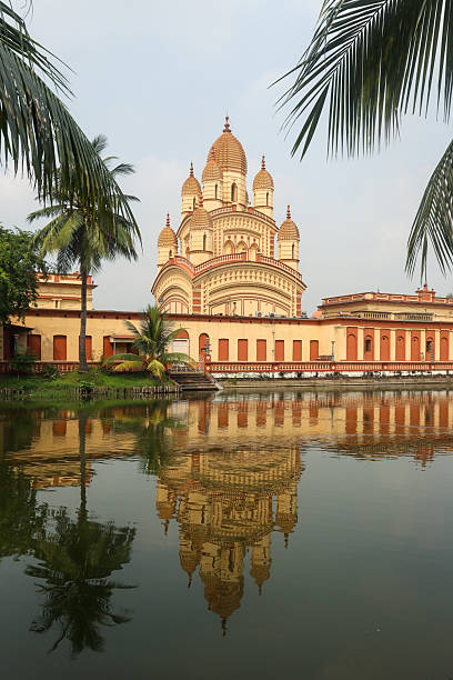 An architectural marvel of Bengal, the Dakshineswar Kali Temple in Kolkata stands as a prominent Hindu pilgrimage site dedicated to Goddess Kali. The iconic nine-spired structure reflects the grandeur of Bengal temple architecture, drawing devotees and visitors seeking spirituality, history, and cultural heritage.