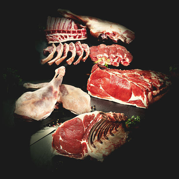istock Beef sirloin steaks and T-bone steaks on a stone or black slate background. 2237503003