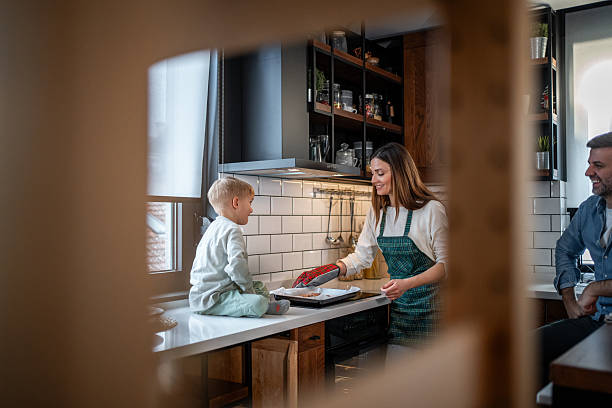 istock Family baking cookies in kitchen, bonding together 2237505997