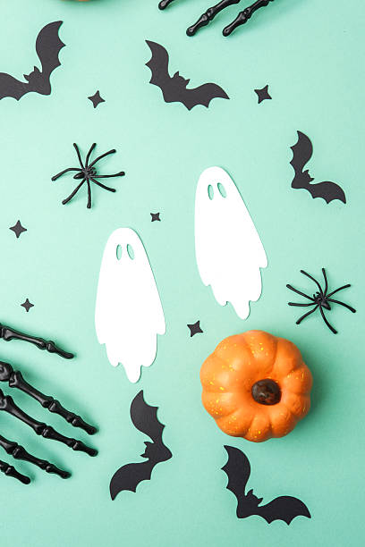 istock Halloween party decorations with pumpkin bats ghosts spiders and skeleton hands spread out 2237512963