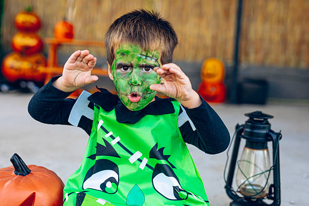 Happy boy in costume on Halloween party, having fun on Halloween day.