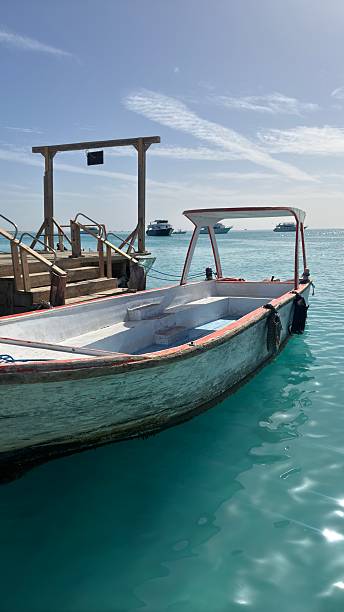 istock Old boat at the pier on turquoise sea 2237518952