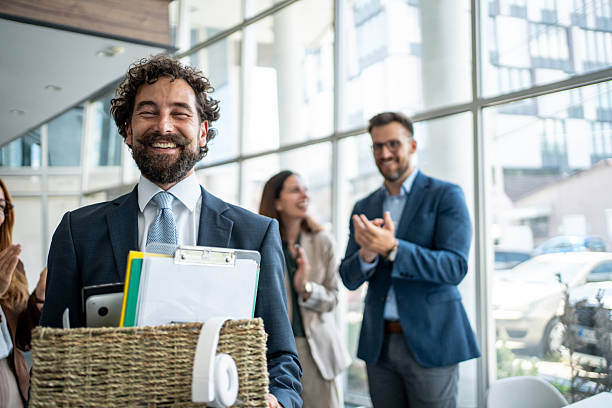 istock Happy businessman leaving office with box, colleagues applauding 2237519301