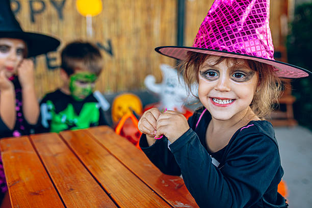 istock Kids sitting together during Halloween celebration 2237520361
