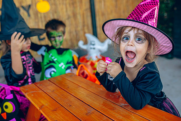 istock Kids sitting together during Halloween celebration 2237520405