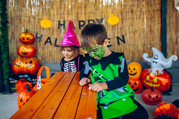 istock Kids sitting together during Halloween celebration 2237520631