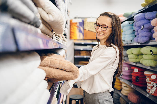 istock A young woman choosing things in a store 2237521277