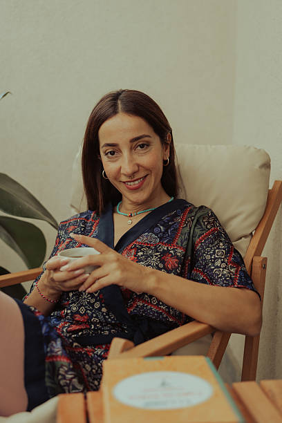 istock Woman relaxing at home, enjoying hot tea 2237522176