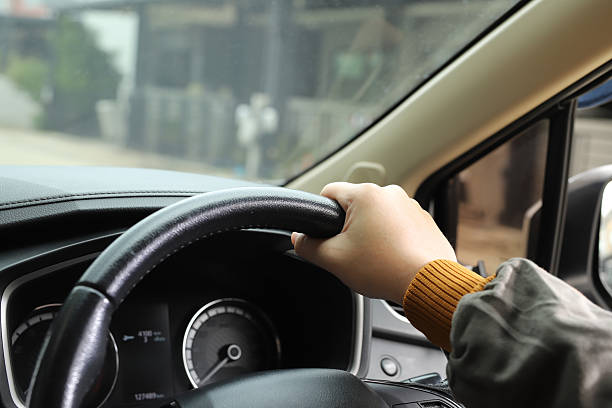 istock Man is driving safely on the road 2237524524