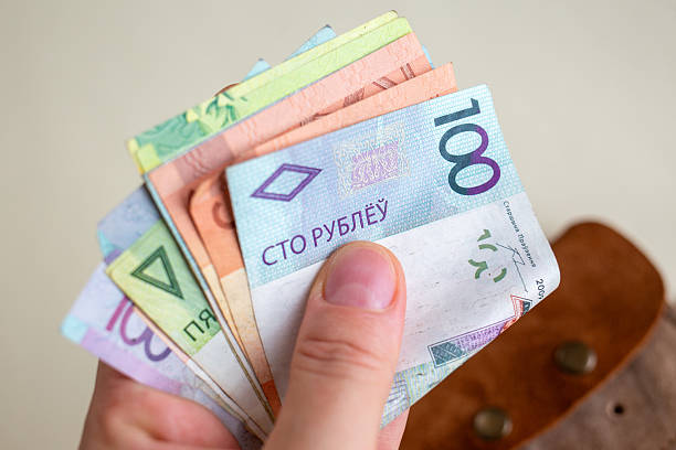 istock Hand fanning out Belarusian ruble banknotes 2237526749