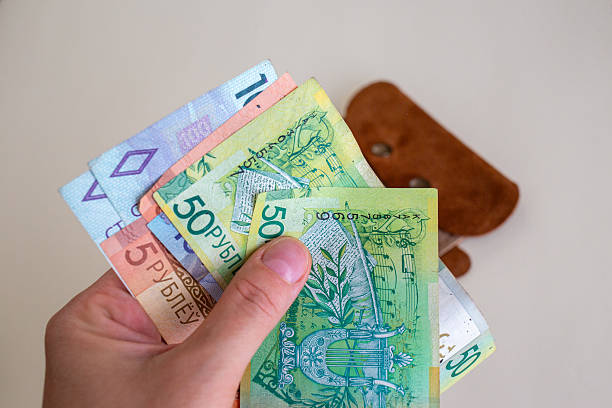 istock Hand holding colorful Belarusian ruble banknotes 2237526922