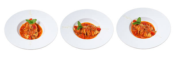 Trio of Culinary Delights: A delightful presentation of three identical plates of appetizing seafood pasta dishes, each garnished with a fresh basil sprig.
