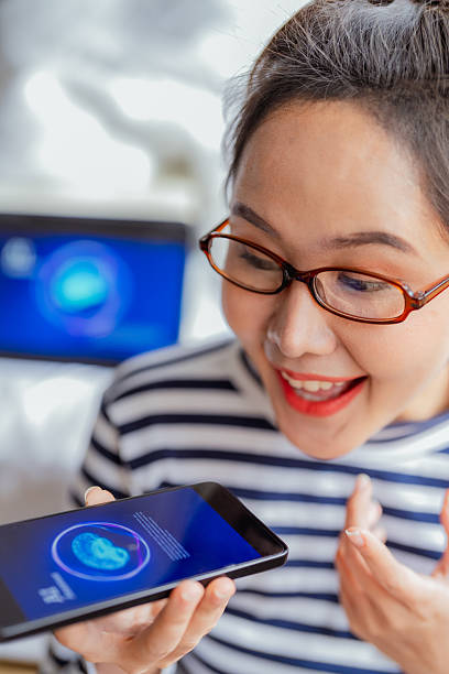 istock Woman working from home sits on bedroom floor using AI chatbot assistance for financial research and big data analysis with laptop and smartphone in natural daylight technology workspace 2237529552