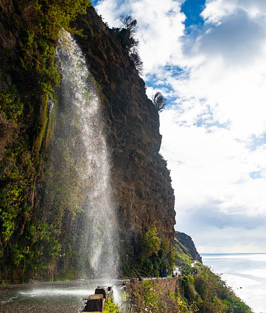 istock Cascata dos Anjos Waterfall Over Road in Madeira 2237532944