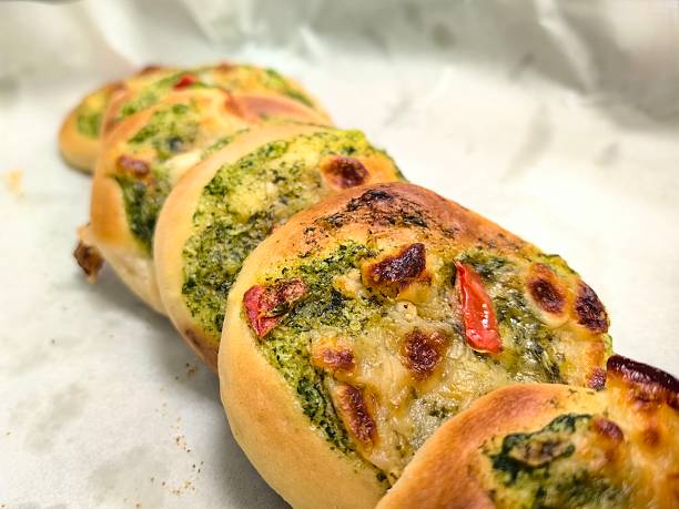 istock A few slices of savory mini pizza with a vegetable topping. 2237534948
