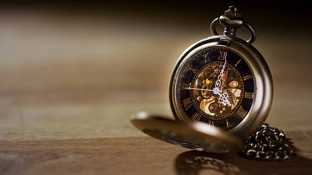 istock Antique pocket watch on wood 2237539740