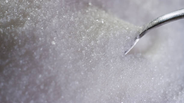 istock Close up of granulated sugar with spoon 2237539756