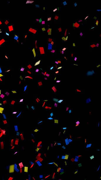 istock Multicolored paper ribbons, free falling confetti on a black background 2237539851