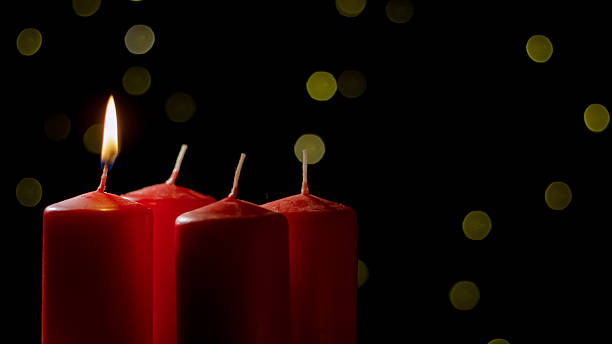 istock Burning candle on a festive black background with golden decoration 2237540374