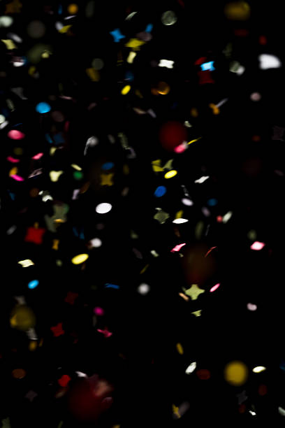 istock Falling colorful confetti on a black background, festive backdrop 2237540988