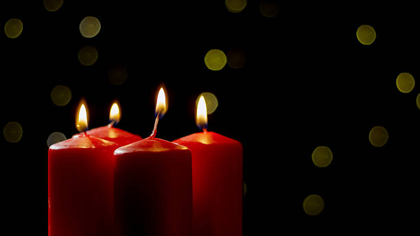 istock Warm glow of red candles at night 2237541274