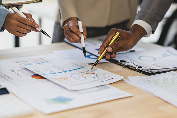 istock Business people analyzing financial charts and graphs, developing investment strategy for successful business growth. 2237543234