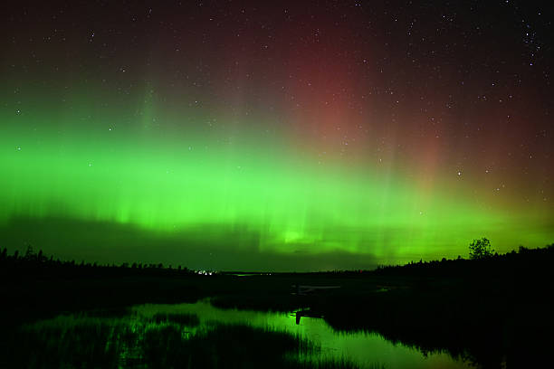 istock Northern Lights or Aurora Borielis reflecting over a river 2237543559