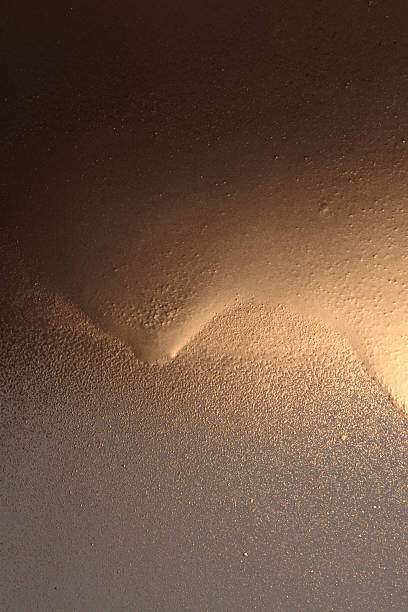 istock Glow Gold and bronze glitter color flow liquid painting light and shadow background. 2237546352