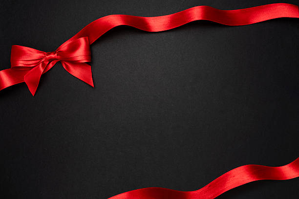 istock Red gift bow on dark background, luxury festive frame with copy space 2237548634