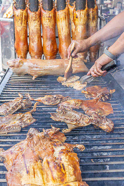 Typical food of Ecuador: guinea pig roasting on the grill, prepared with traditional Andean techniques that preserve cultural essence and offer a unique gastronomic experience.