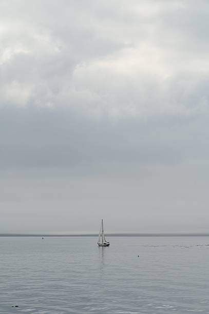 istock Solitary Sailboat on a Calm Sea 2237550139