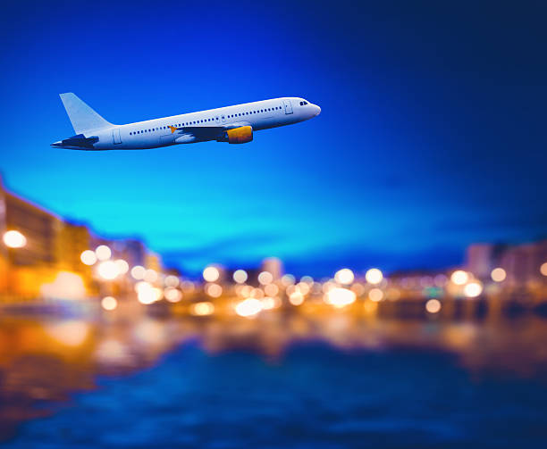 istock Jet airliner in flight over city. 2237551617