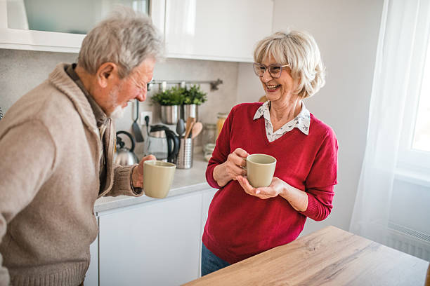 istock Candid morning moment: elderly couple drinking coffee together 2237551821
