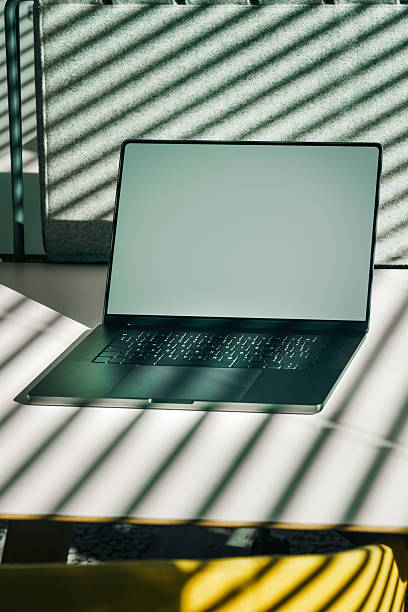 istock Laptop Screen Mockup Office Desk Sunlight Shadows 2237554186