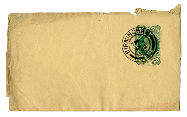 A small brown envelope posted in Birmingham in 1902, printed with a green halfpenny stamp with the head of King Edward VII.