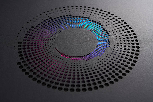 istock Spiral Gradient Dot Cutout on Black Paper Forming a Vivid Circular Pattern 2237554697