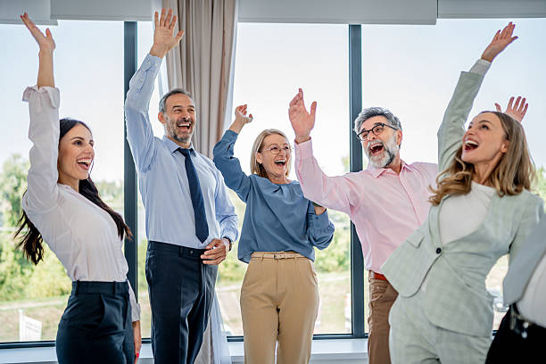 istock Business people celebrating success in modern office 2237555849