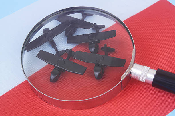 istock Military drone models on Polish flag under magnifying glass. 2237556120