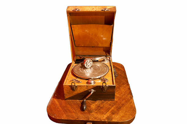 istock Vintage gramophone with wooden casing displayed on a circular table in a warm indoor setting 2237556265