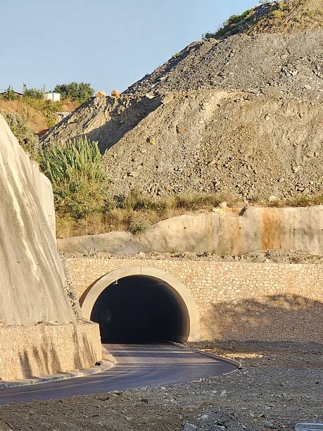 istock Construction of road tunnel under the mountain and hill. 2237556632