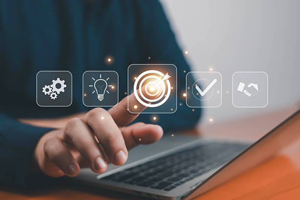 istock Businessman touching glowing digital target icon on laptop, symbolizing goal setting, business strategy, success, vision, leadership, planning, innovation, teamwork, achievement, and growth concept. 2237558712