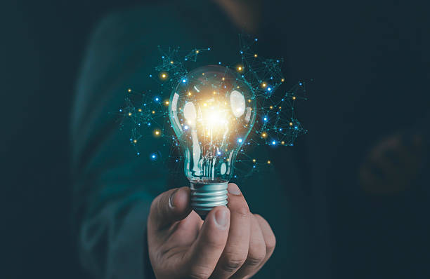 istock Businessman holding glowing light bulb with digital network, symbolizing innovation, creativity, technology, big data, artificial intelligence, smart ideas, energy, business solutions, future vision. 2237558715