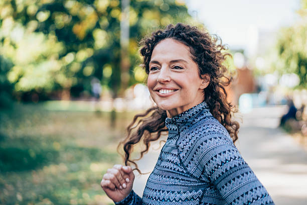 istock Woman jogging in the park. 2237558989