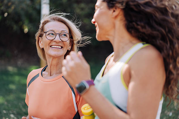 istock Friends talking and running in the public park. 2237559001