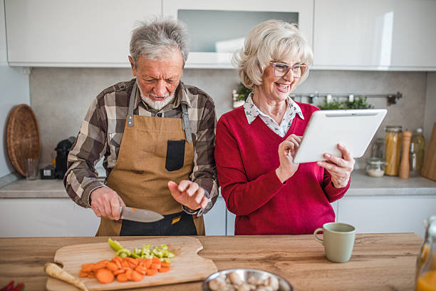 istock Senior married couple cooking together using online recipe 2237559166