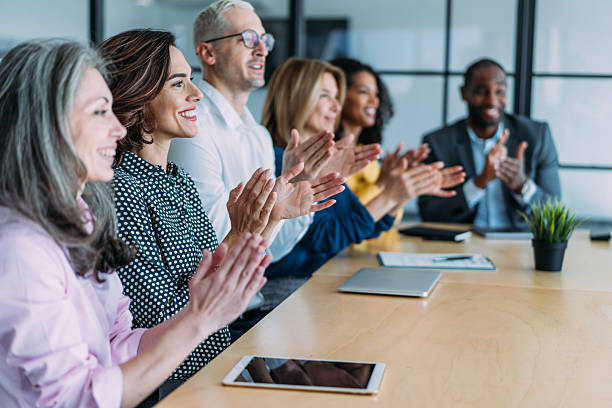istock Businesspeople applauding during a seminar in conference hall. 2237561454