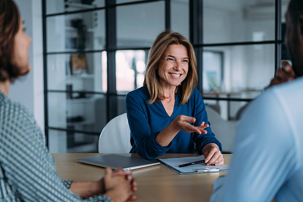 istock Group of business persons talking in the office. 2237561463