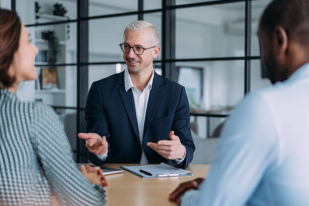 istock Group of business persons talking in the office. 2237561480